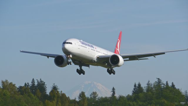 BOEING 777-300 (TC-LJA) - BOE539 on final to Rwy 34L to complete a ferry flight from KVCV on 4/19/15. (ln 1296 / cn 44121). Mt Rainier is in the distance.