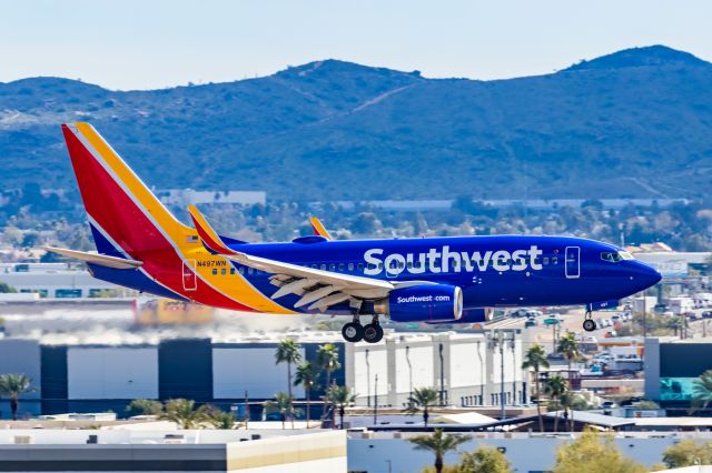 Boeing 737-700 (N497WN) - A Southwest Airlines 737-700 landing at PHX on 2/28/23. Taken with a Canon R7 and Canon EF 100-400 L ii lens.