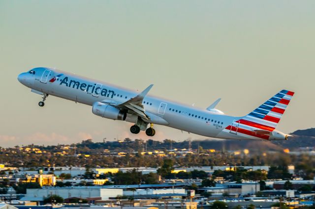 Airbus A321 (N125AA) - American Airlines A321 taking off from PHX on 10/16/22. Taken with a Canon 850D and Tamron 70-200 G2 lens.