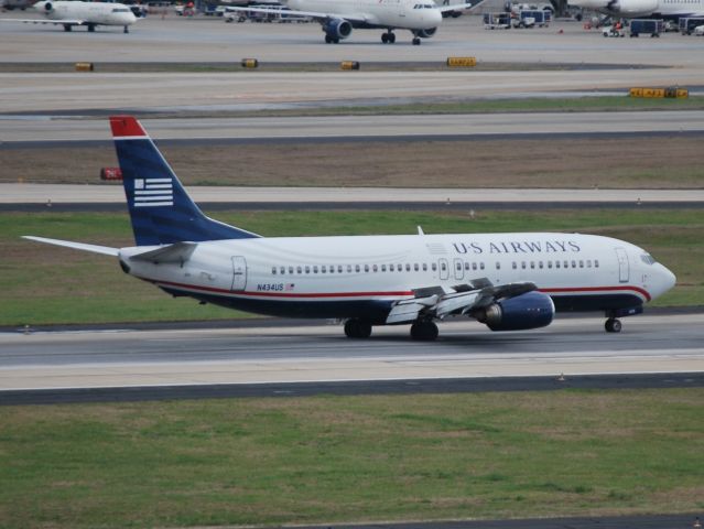 BOEING 737-400 (N434US) - Arriving runway 26R - 4/5/13