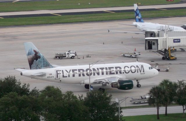 Airbus A320 (N953FR) - From Level 9 Short Term parking. The Saturday afternoon flight arrives.