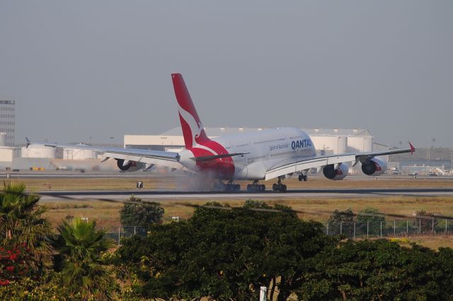 Airbus A380-800 (VH-OQB) - This A380 lands 24R in early a.m. light!