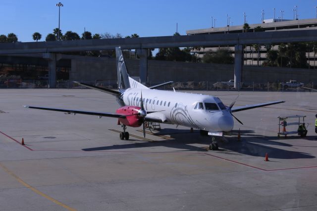 N334AG — - Silver flight ready for passenger loading at Tampa. 16 Feb 17br /Sorry about the dirty windows of the terminal (some smudges on the photo.)