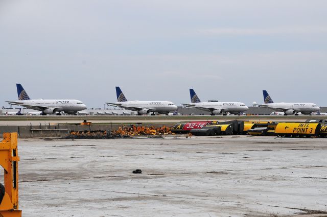 Airbus A319 (N807UA) - Four of Uniteds A319's parked because of Corona. N807UA, N815UA, N841UA, N845UA.