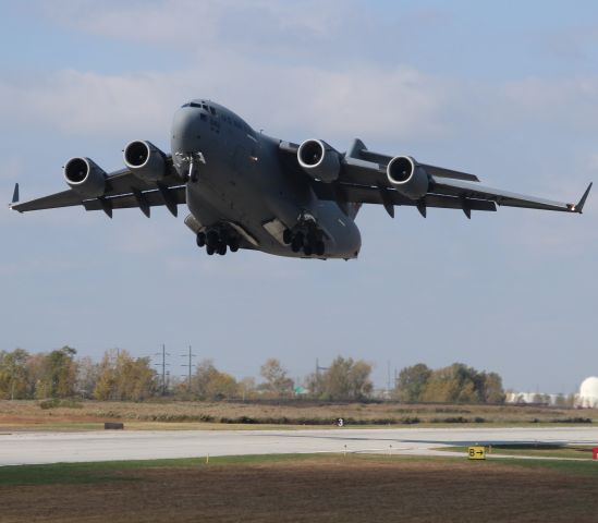 — — - Watching C-17 takeoff from Taxiway "Alpha at Gary Regional Airport. 