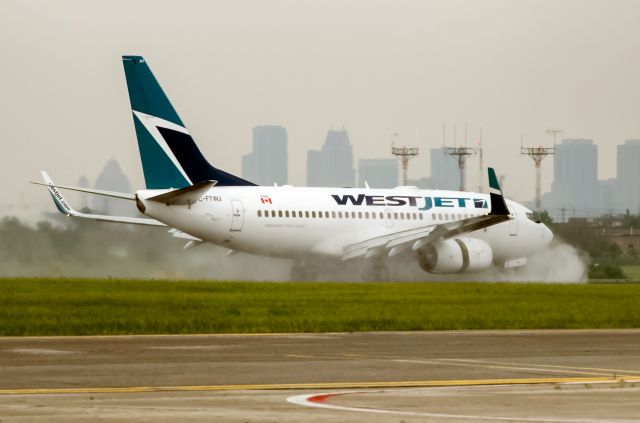 Boeing 737-700 (C-FTWJ) - WestJet 737 C-FTWJ water fun