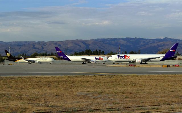 BOEING 767-300 (N101FE) - All three Freighters lined up at SJC, along with N655FE and N326UP.