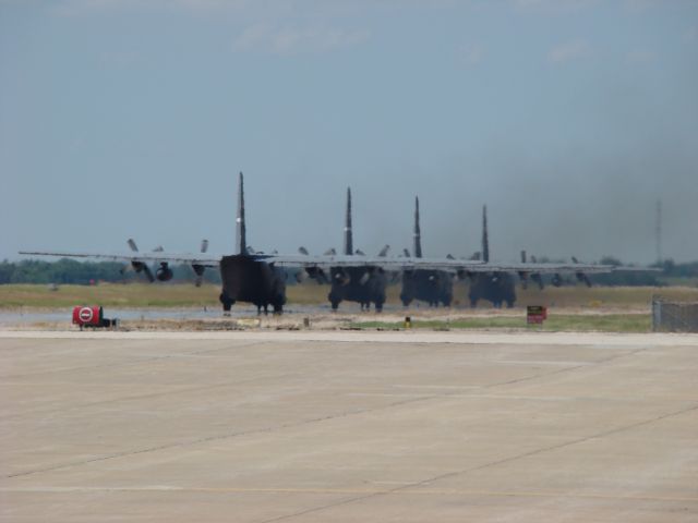 Lockheed C-130 Hercules — - Four C-130s taxiing to leave Salina, Kansas 06212009.  Can you smell the fuel burn in the air?