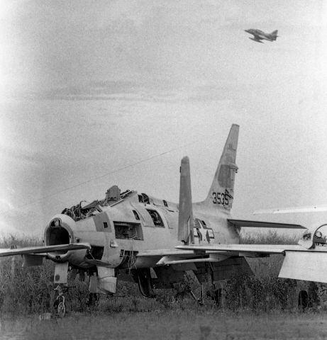 14-3535 — - An A-4 Skyhawk flies over a less-than-flightworthy North American FJ-4B Fury