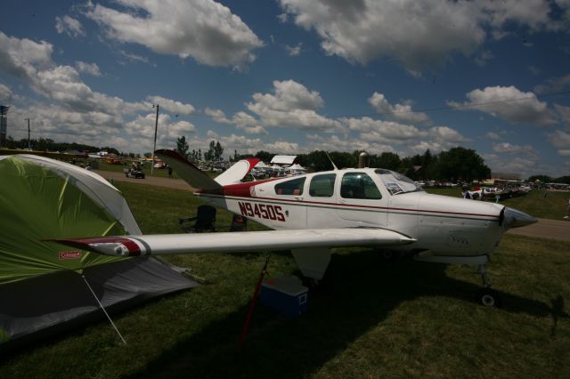 Beechcraft 35 Bonanza (N9450S) - See more planes from the 2013 EAA Airventure here- a rel=nofollow href=http://www.facebook.com/media/set/?set=a.10153121083865078.1073741840.283142505077&type=1https://www.facebook.com/media/set/?set=a.10153121083865078.1073741840.283142505077&type=1/a