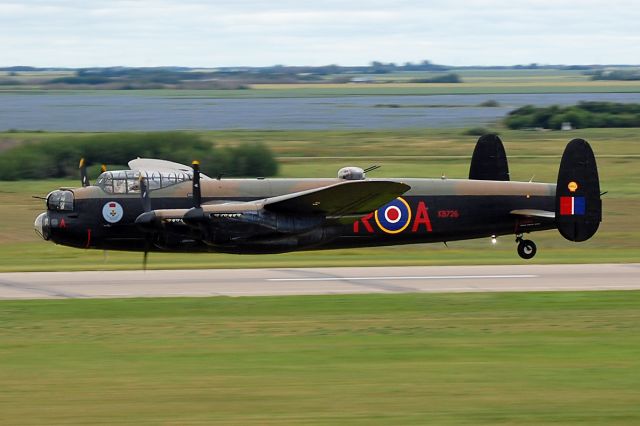 C-GVRA — - An Avro Lancaster doing a low pass past the control tower.