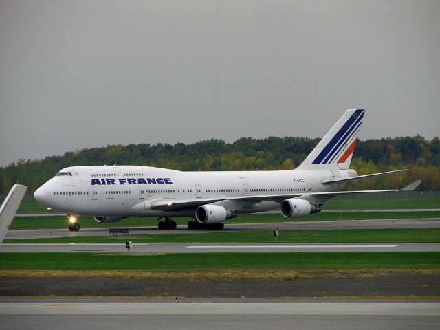 Boeing 747-200 (F-GITC) - Air France F-GITC taxiing at Montréal Trudeau Airport, taken from the departure lounge on Sept. 27, 2009