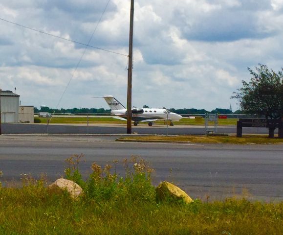 Cessna Citation Mustang (N610PT) - Unecpected car trouble brought me out to Findlay Ohio Airport. Miles and miles of open country, EXCEPT at the Findlay ramp where there beautiful little Mustang was parked as of 8/9/2016. Unfortunately my tow vehicle was enroute so crossing the street for a clear shot wasnt possible.