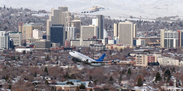 BOEING 737-300 (N623SW) - Climbing away from Reno Tahoe International, SWQ's N623SW passes between my photo position on Rattlesnake Mountain and downtown Reno as it begins a "passenger delayed*" flight to San Antonio (KSAT).br /br /* N623SW's departure from KRNO was delayed after it had pushed back from the gate and was taxiing to Runway 16R by a passenger who decided to use the restroom. The aircraft was forced to stop on the terminal apron blocking the entrance to the alley. A just-arrived Mesa Airlines flight which had been directed to give way to the Swift flight so it could exit the alley was then forced to hold on Alpha taxiway. It took the passenger about 5 minutes to complete his / her "business" and return to her / his seat. As I stood at the top of Rattlesnake Mountain listening to this rather unusual activity being explained to the tower and the Mesa pilots, I found myself wondering how that particular passenger felt as the entire planeload of SWQ passengers watched him / her returning to her / his seat ... all refreshed and ready to eat some peanuts.br /In actuality, there are several valid reasons why a passenger might suddenly find himself / herself in a situation requiring immediate access to a restroom.  Hey, we've all either 'been there' or come da-n close to being there.  (Wave)