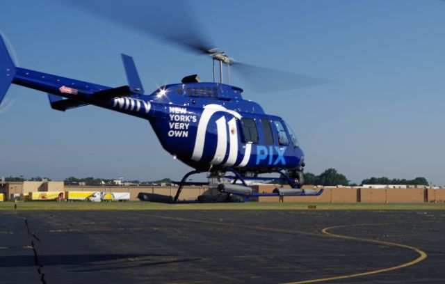Bell JetRanger (N11TV) - LINDEN AIRPORT-LINDEN, NEW JERSEY, USA-AUGUST 29, 2018: A news helicopter from one of the local New York City T.V. stations is pictured after refueling.