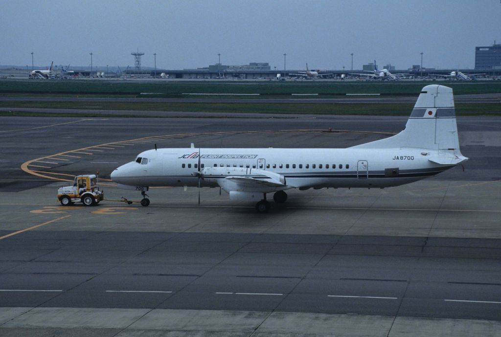 NAMC (1) YS-11 (JA8700) - Traction at Tokyo-Haneda Intl Airport on 1995/04/29