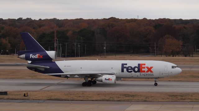 McDonnell Douglas DC-10 (N306FE) - "John" taxis after arrival on 18R.