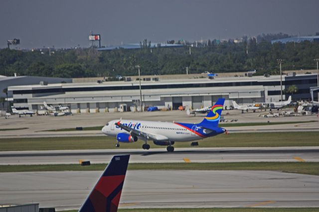 Airbus A319 (N602NK) - A hefty crosswind on 27R.  05NOV2010