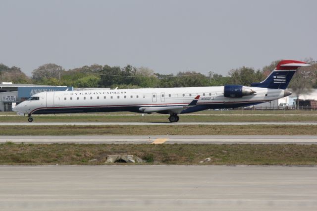 Canadair Regional Jet CRJ-900 (N910FJ) - Mesa/US Air Flight 2647 (N910FJ) departs Runway 32 at Sarasota-Bradenton International Airport enroute to Charlotte/Douglas International Airport