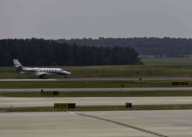 Cessna Citation Excel/XLS (N627XL) - Standing on the general aviation observation balcony at the GA terminal.