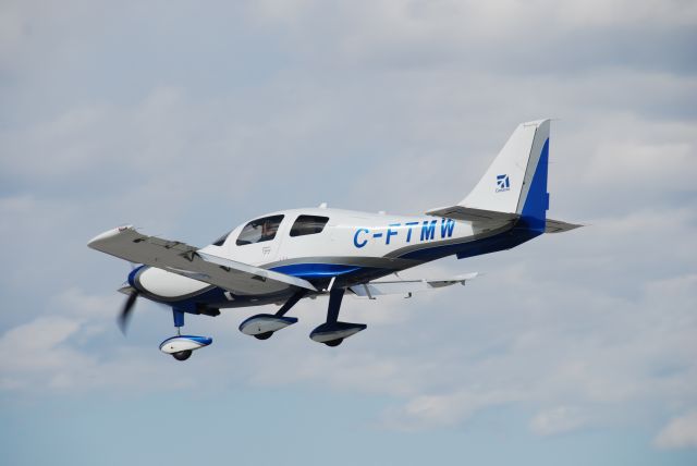 Cessna 400 (C-FTMW) - Cessna 400 landing at Torontos Buttonville Airport - Apr 11/2010.