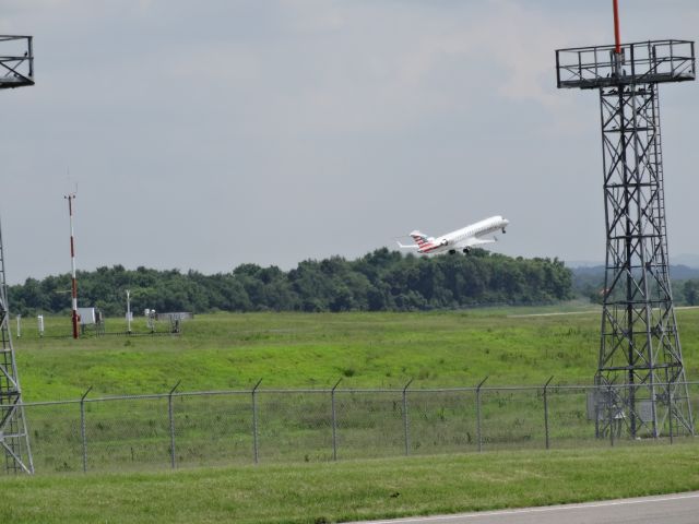 Canadair Regional Jet CRJ-700 (N524AE) - Standing just south of runway 02C, I was able to capture several aircraft on take-off