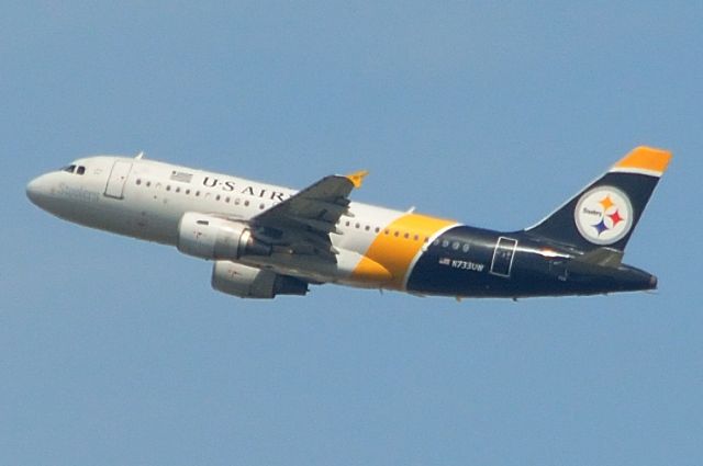 Airbus A319 (N733UW) - A very distant picture full of grain—sorry... Departing DFW 05/10/2013.