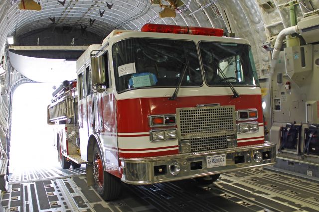 Boeing Globemaster III (05-5140) - Our last arriving piece of fire apparatus being offloaded from a C-17 (05-5140, c/n P140) at Sparta/Fort McCoy Airport, a few miles from Young Air Assault Strip (WS20) on 15 July 2013.