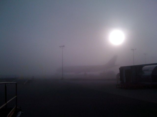 — — - UPS A300 in morning fog