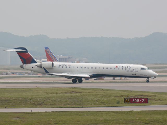 Canadair Regional Jet CRJ-700 (N656CA) - Landing 20R on 2013/05/19