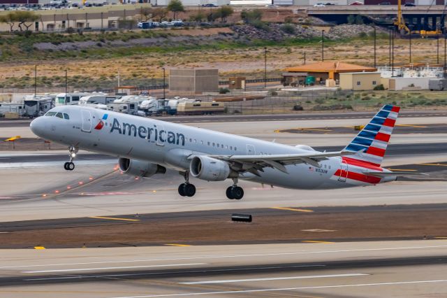 Airbus A321 (N153UW) - An American Airlines A321 taking off from PHX on 2/14/23. Taken with a Canon R7 and Canon EF 100-400 II L lens.