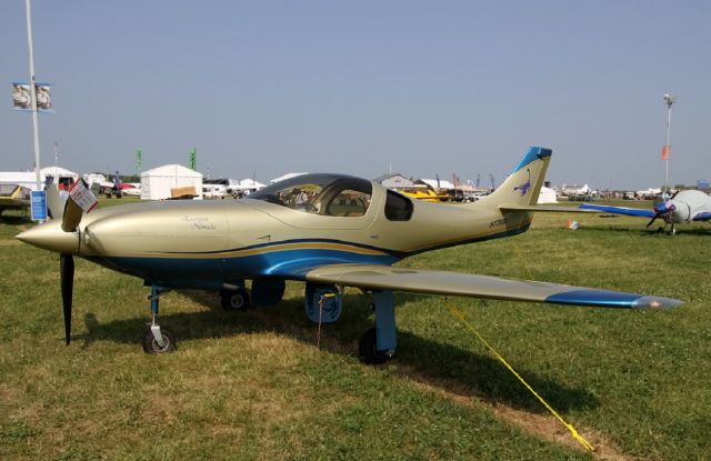 Lancair Legacy 2000 (N7799R) - "Escorpión Nómada" - emblazoned on N7799R nose - 2011 Lancair Legacy shown on display at Oshkosh. 