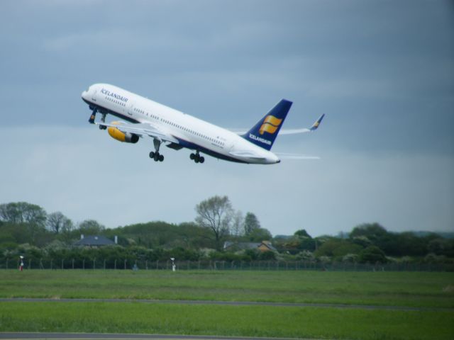 Boeing 757-200 (TF-FIY) - TF-FIY Boeing 757-256 cn 29312/943 ex P2-ANB Seen here airborne as he is flying empty to keflavik hence the early airborne in line with taxiway golf.it was so quick he took off on 05-05-2011