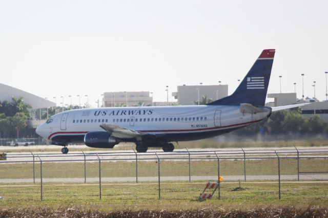 BOEING 737-400 (N516AU) - US Airways Flight 1988 (N516AU) departs on Runway 6 at Southwest Florida International Airport enroute to Charlotte/Douglas International Airport