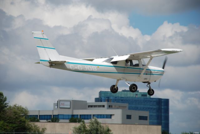 Cessna Commuter (C-GJOB) - A 1976 Cessna 150 of Toronto Airways Flight School landing at Buttonville Airport, Toronto area.