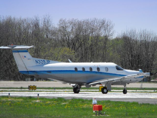 Pilatus PC-12 (N328JP) - This Single Engine Turbo Prop is shown here departing in the Spring of 2013.