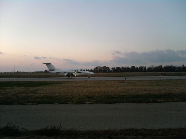 Eclipse 500 (N38DA) - Evening Departure Eclipse 500, LEX, 11/17/2010.  That thing moved out!  Im sure its a pretty fun ride!    Sorry, not the best quality, it was with my phone, through the fence.