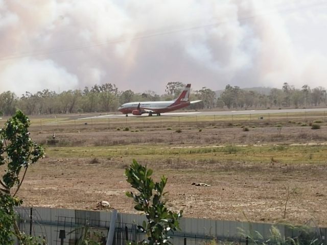 BOEING 737-300 (BMBR137) - Backtracking runway 33 Rockhampton at the peak of the bushfire emergency at Gracemere November 30, 2018