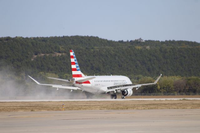 Embraer 175 (N205NN) - MHK was closed summer 2023 for runway construction (note the ample amounts of dust from the finished runway) and reopened on Sept 25 for commercial traffic. This is the moment of touch down!