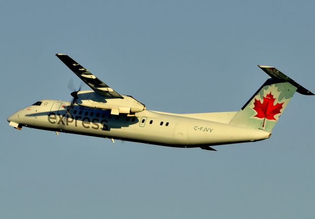 de Havilland Dash 8-300 (C-FJVV) - Departing Rwy 07 to YUL/CYUL at sunset.