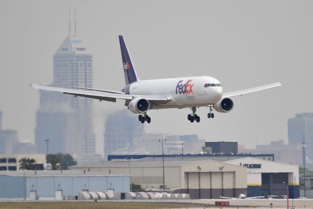 BOEING 767-300 (N187FE) - On final for 23-L with the city of Indianapolis as a backdrop. Taken on 09-23-20