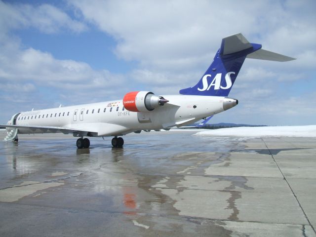 Canadair Regional Jet CRJ-900 (OY-KFE) - Parked at Irving Aviation FBO, Goose Airport NL. April 26/09