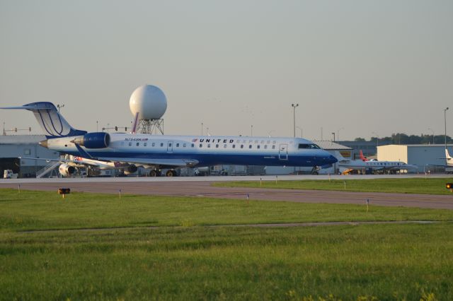 Canadair Regional Jet CRJ-200 (N754SK) - 6-9-2012 - Departing KFSD bound for KDEN.