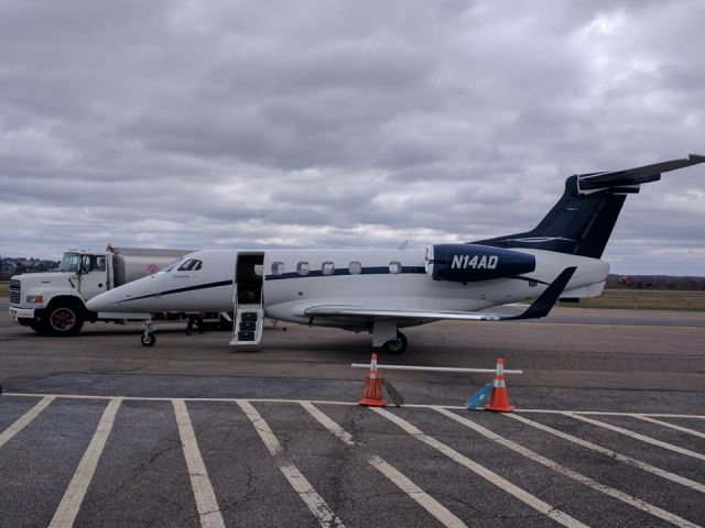 Embraer Phenom 300 (N14AQ) - Embraer Phenom 300 being fueled at KHZL