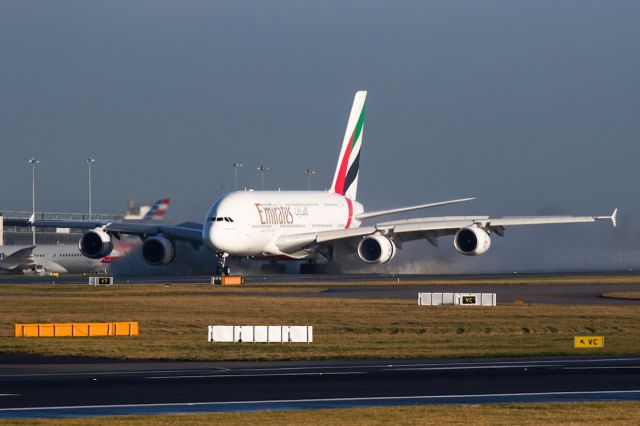Airbus A380-800 (A6-EEC) - EK17, the late morning arrival from DXB, producing some spray.
