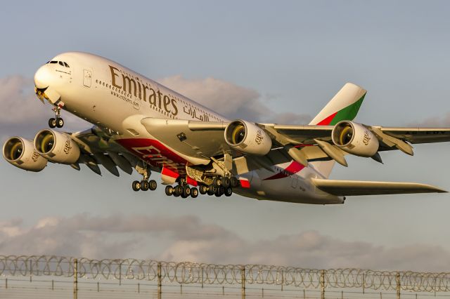 Airbus A380-800 (A6-EDV) - 8th October, 2022: Taking off into the sunset from runway 27L at Heathrow as flight EK 30 bound for Dubai.
