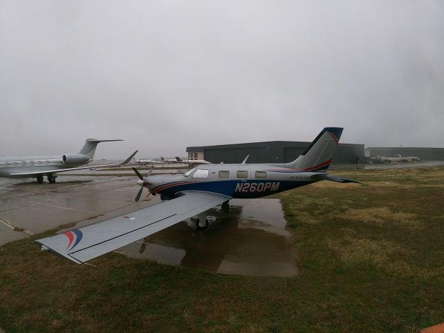 Piper Malibu Mirage (N260PM) - On the east side of Addison airport by the ATP location, this Meridian owned by Martin Paving Company Inc was parked on this ramp used by the Atlantic FBO on the field. 