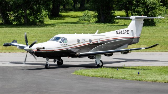 Pilatus PC-12 (N245PE) - N245PE turning off of College Park Airport's runway 33 after a backtrack and a flight from HPN 