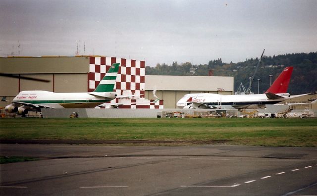 Boeing 747-400 (N662US) - KBFI- Brand new 747 400 series at Boeing Field Nov 1988. On the left is VR-HOO as cn 23814/705 and NWA N662US 23720/708. There were 2 other 747 400 off to the left and were probably the 1st 2 747 400 s built. VR-HOO was re-reg after July 9-1997 after China took over BCC of Hong Kong - re reg to B-HOO. N662US is now absorbed into Delta Airlines. Internet records indicate B-HOO is scrapped.