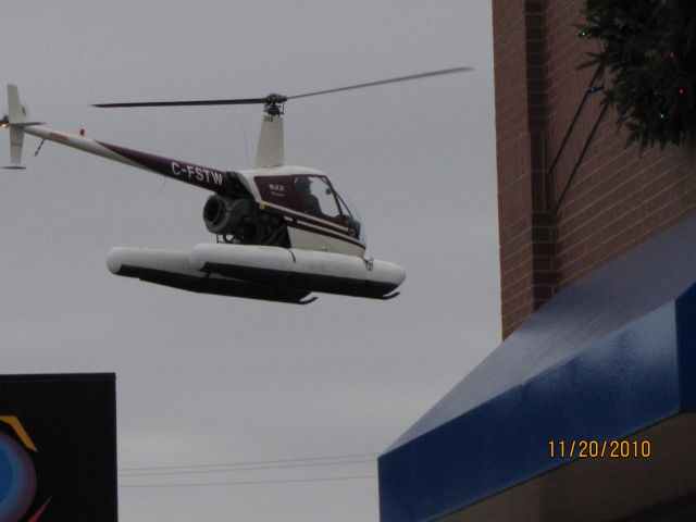 Robinson R-22 (C-FSTW) - Chopper departing after dropping of Santa  at the Mall in Bridgewater NS   Nov 20,2010